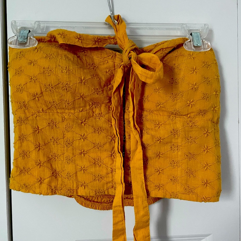 Yellow halter cropped top.